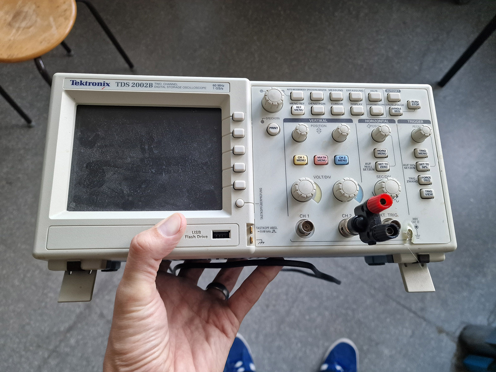 Photo of a Tektronix TDS 2002B digital dual-channel oscilloscope being held by a magic floating hand. When I say "newfangled" I mean that it's just 20 years old rather than the 40 or 50 year old beasts we usually have in service. Photo of a Tektronix TDS 2002B digital dual-channel oscilloscope being held by a magic floating hand. When I say "newfangled" I mean that it's just 20 years old rather than the 40 or 50 year old beasts we usually have in service.