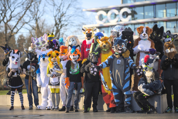 a fursuit group photo in front of the CCH/CCC