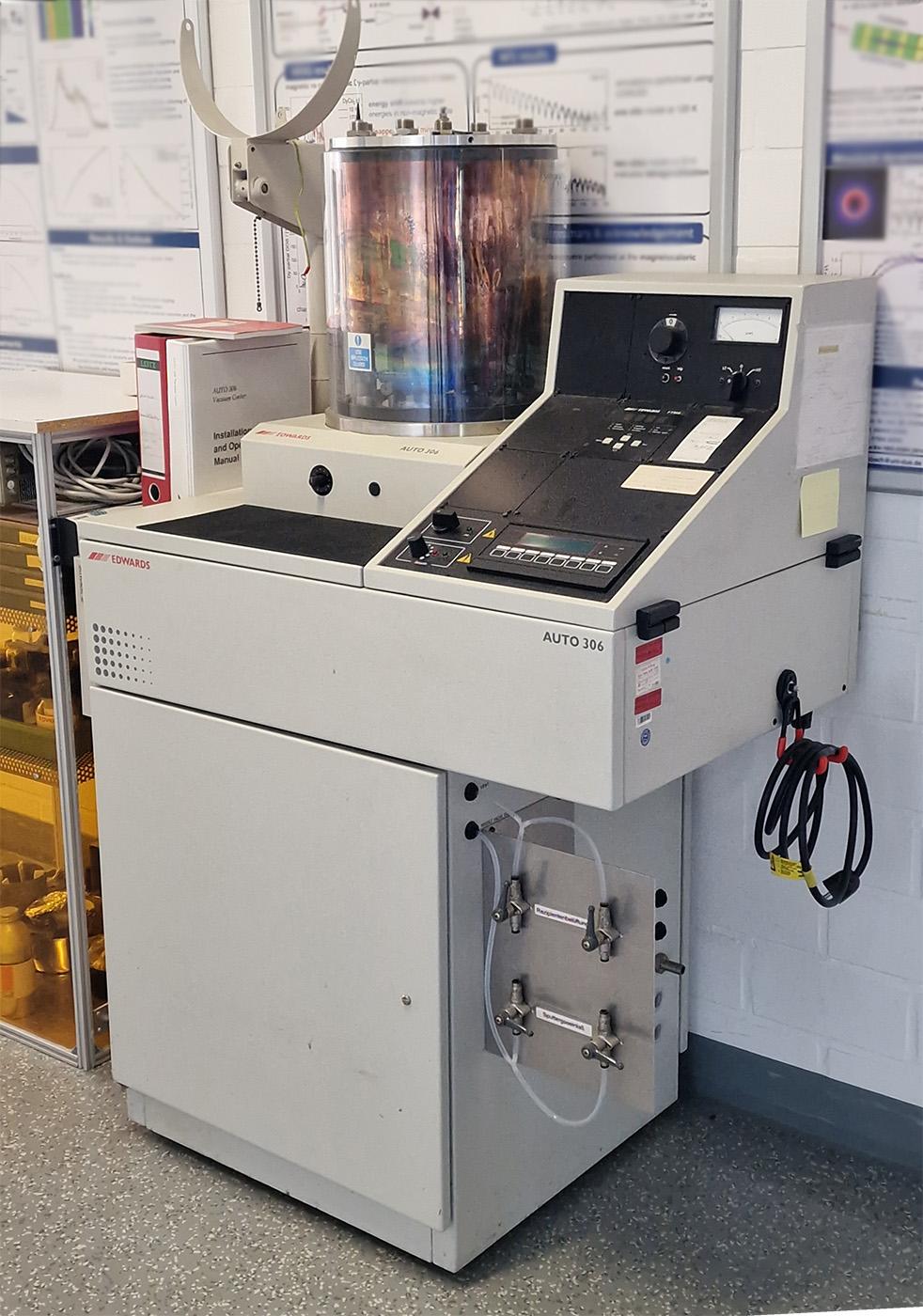 Photo of an Edwards Auto 306 evaporator coating system standing uselessly in a hallway because the asshole who grabbed it is "too busy" doing actual work rather than tinkering with 90s equipment that someone else didn't need anymore. Such a shame.
