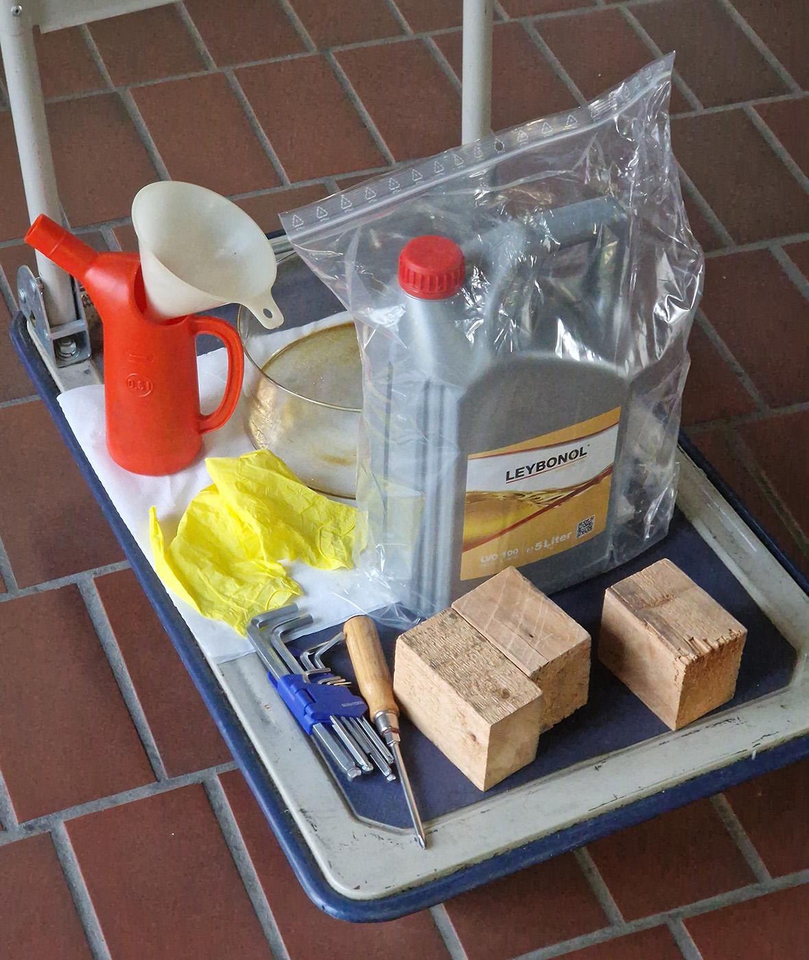 Photo of a dolly with various maintenance-related items, some of which are more obvious in their purpose than others.