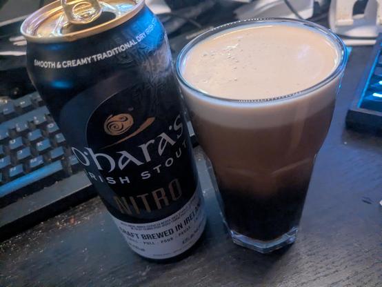Photo of a glass and can of Irish Stout 